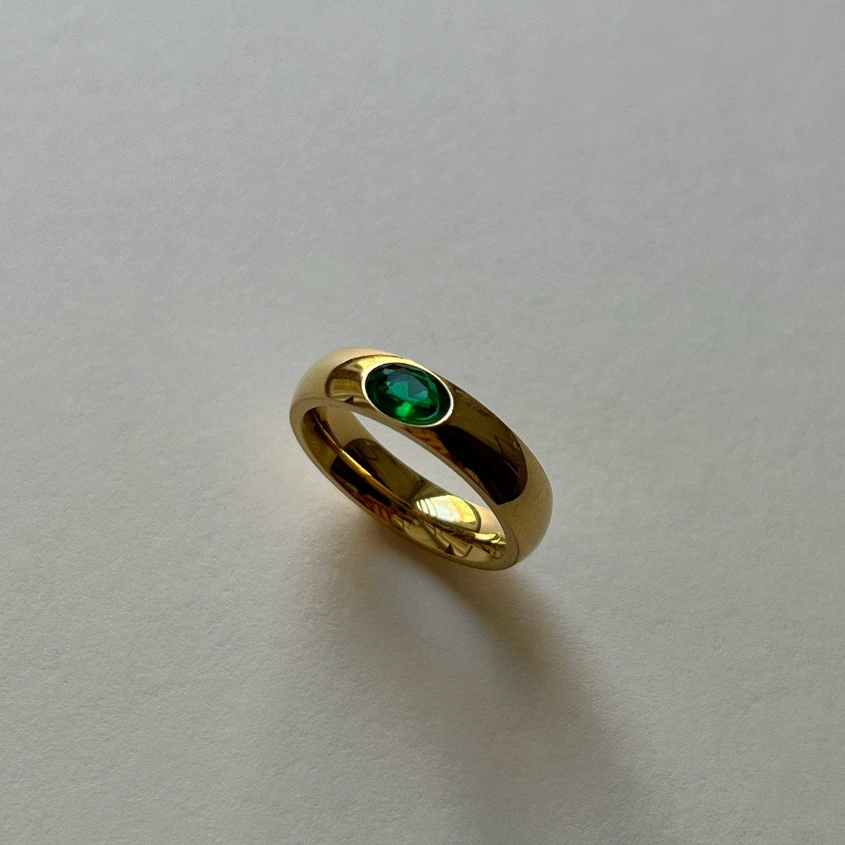 Gold ring with emerald gem