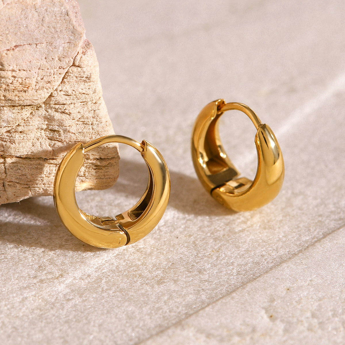 Iris – Gold Geometric Huggie Earrings