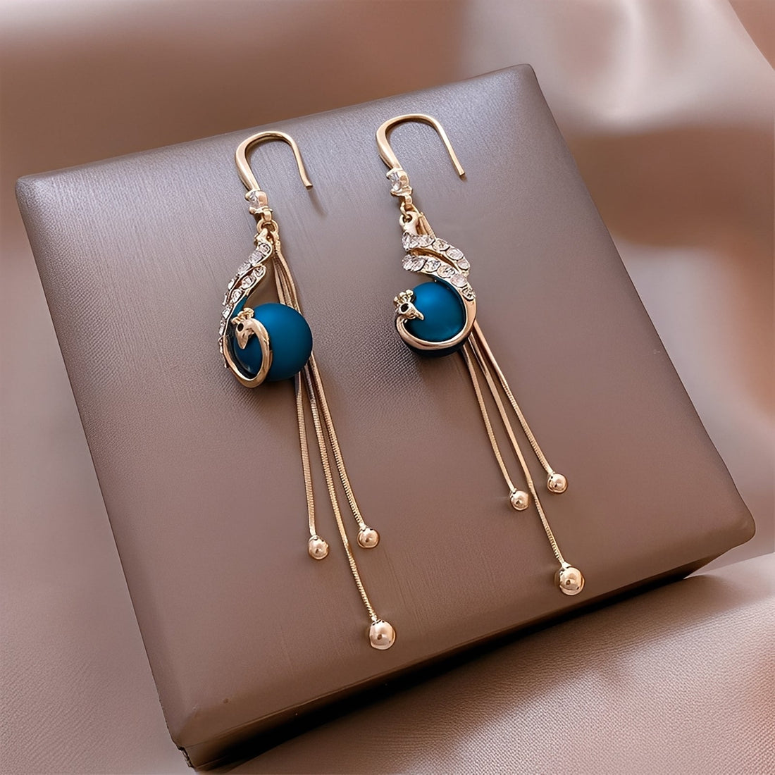 Sheynn – Holiday earrings with blue pearls