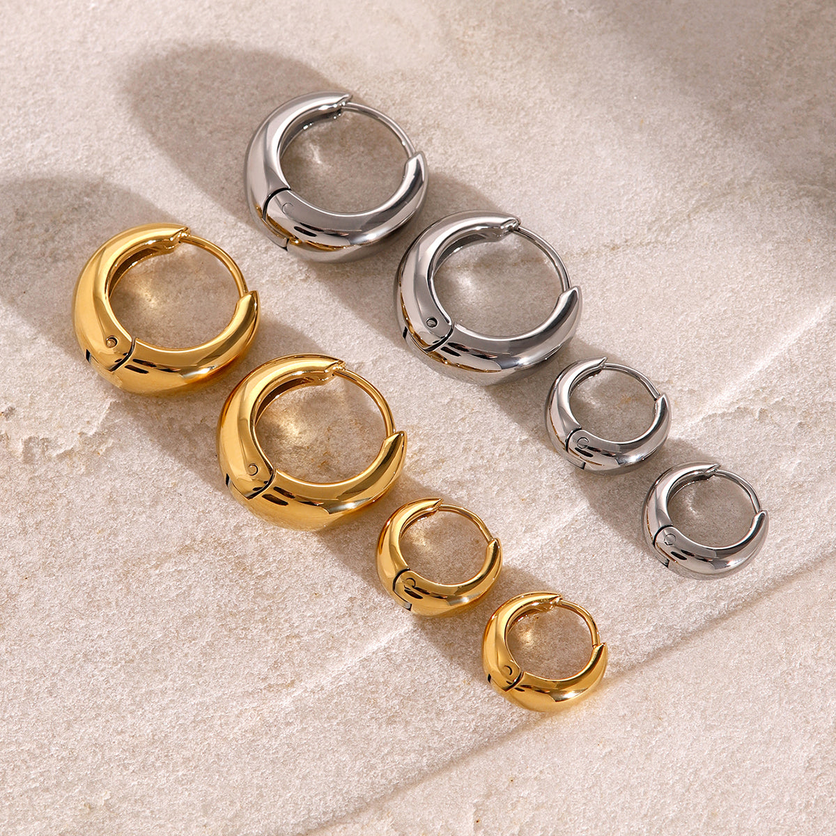 Iris – Gold Geometric Huggie Earrings