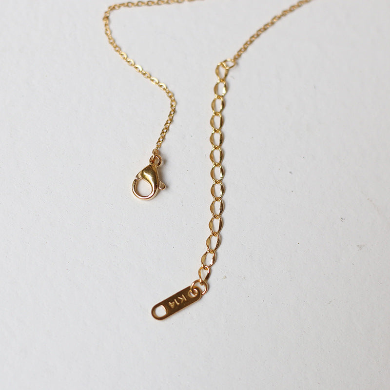 Nelly – Minimalist Cross Necklace in Gold