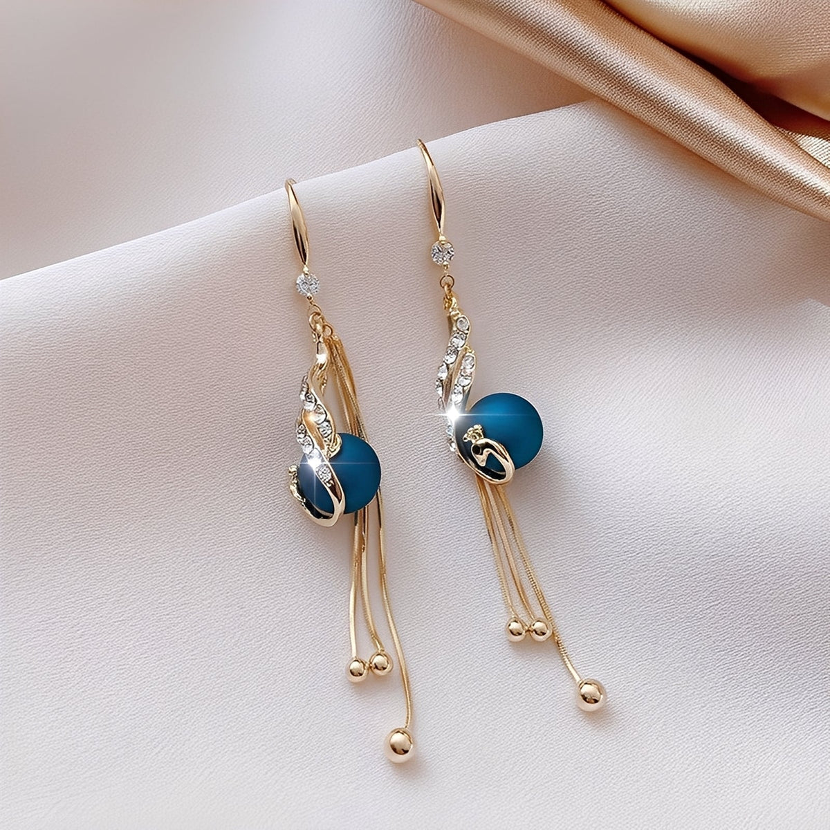 Sheynn – Holiday earrings with blue pearls