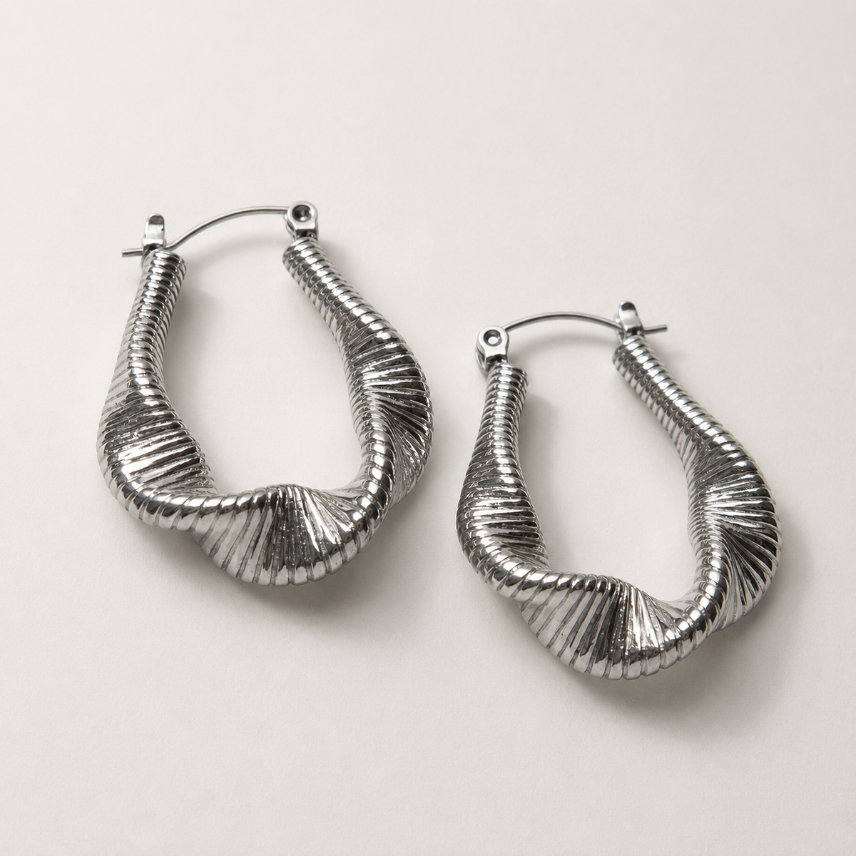 Lyra - Silver hoops with fluid waves