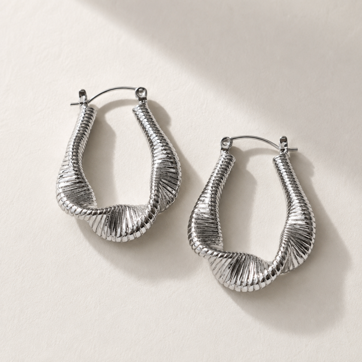 Lyra - Silver hoops with fluid waves
