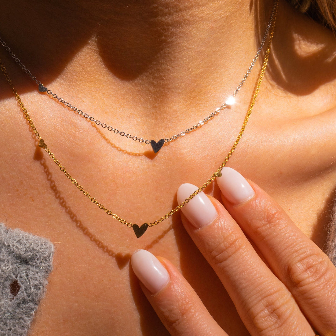 Silver necklace with three hearts