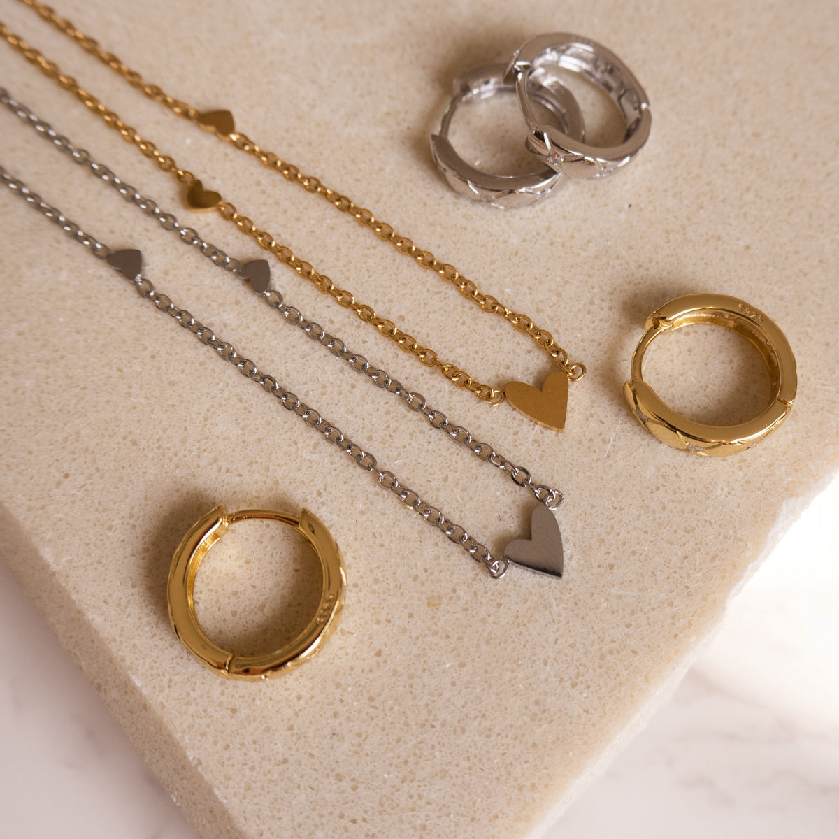 Silver necklace with three hearts