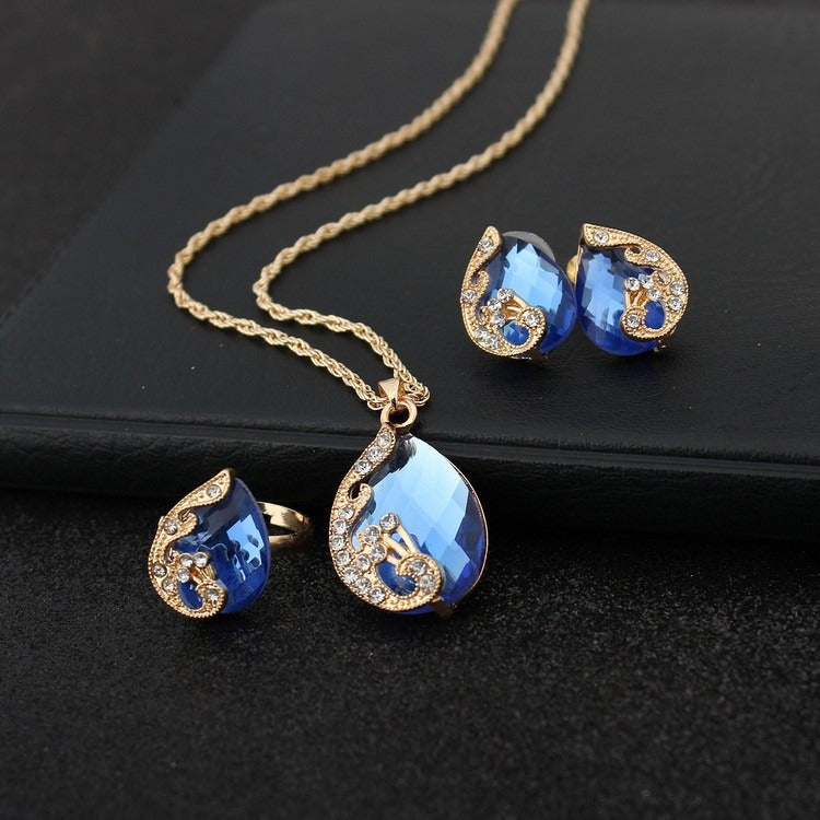 Pia – Jewelry set with necklace and earrings of blue and gold crystal