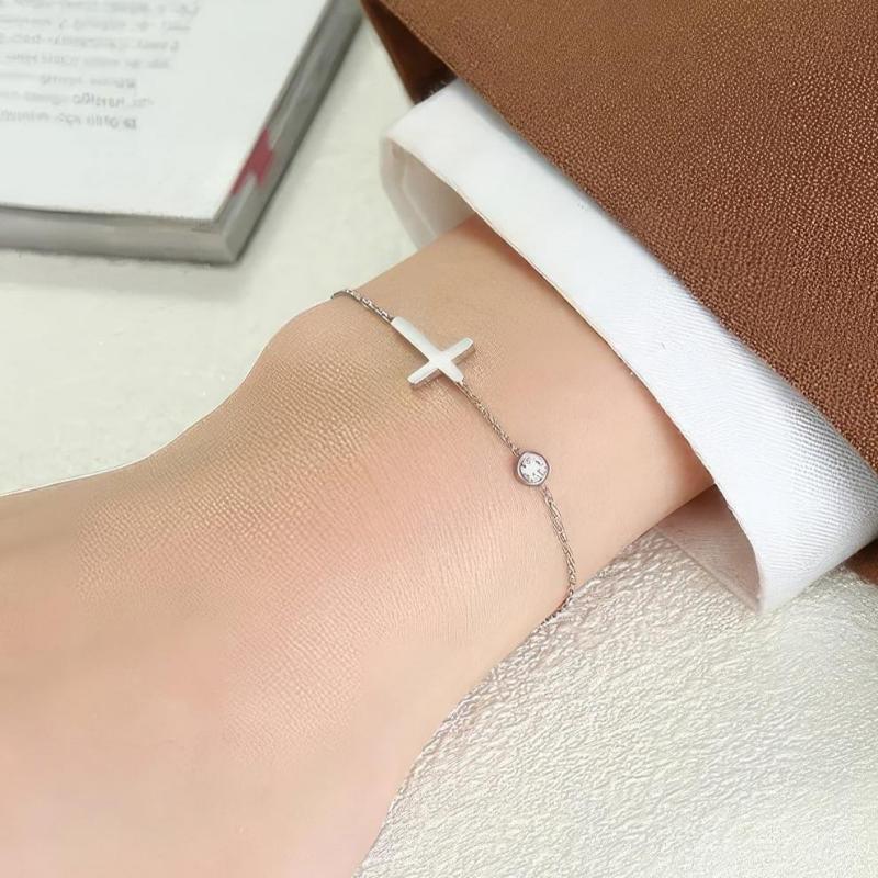 Althea – Bracelet with cross for ladies in gold and silver