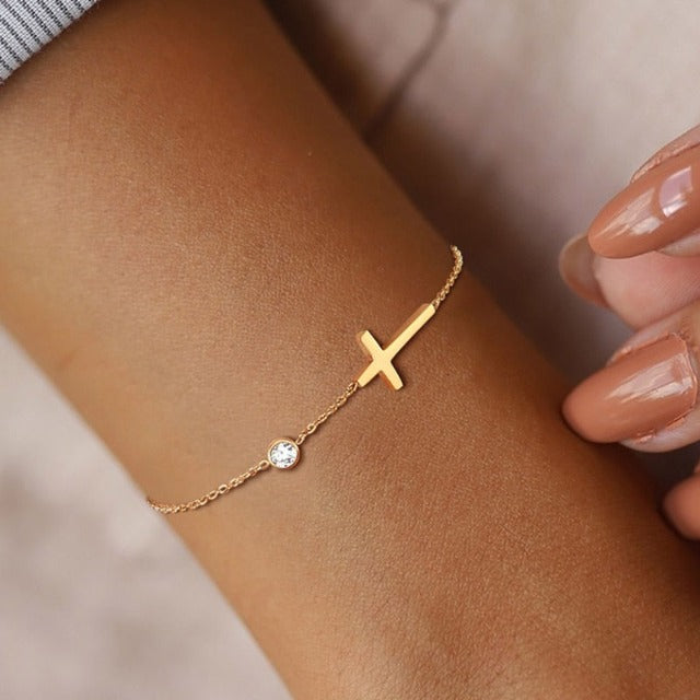 Althea – Bracelet with cross for ladies in gold and silver