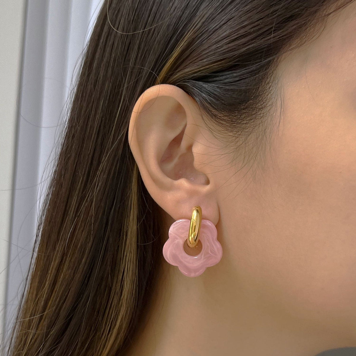 Pink donut hoop earrings with flower charm