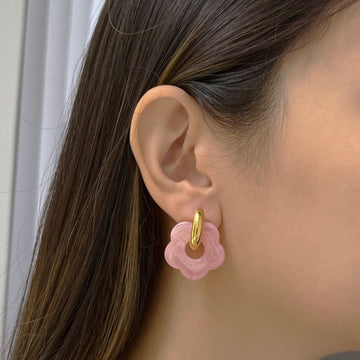 Pink donut hoop earrings with flower charm