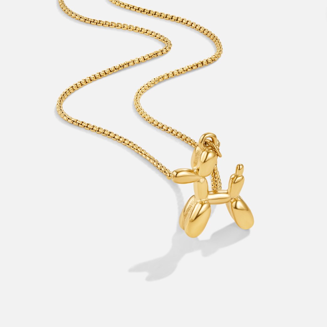 Nerina – Collar with dog and golden balloon pendant