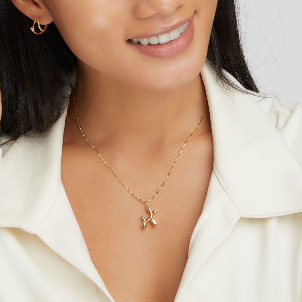 Nerina – Collar with dog and golden balloon pendant