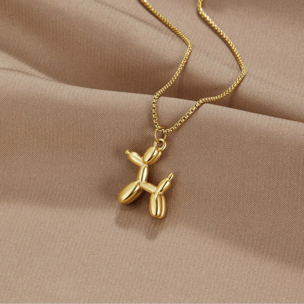 Nerina – Collar with dog and golden balloon pendant