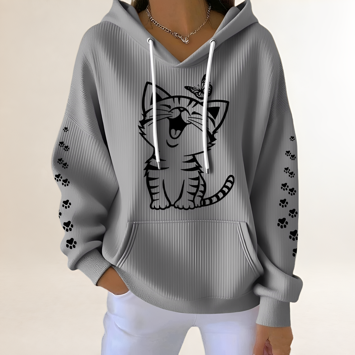Women's hoodie with cat graphic and paw-print sleeves, drawstring hood, kangaroo pocket, relaxed fit