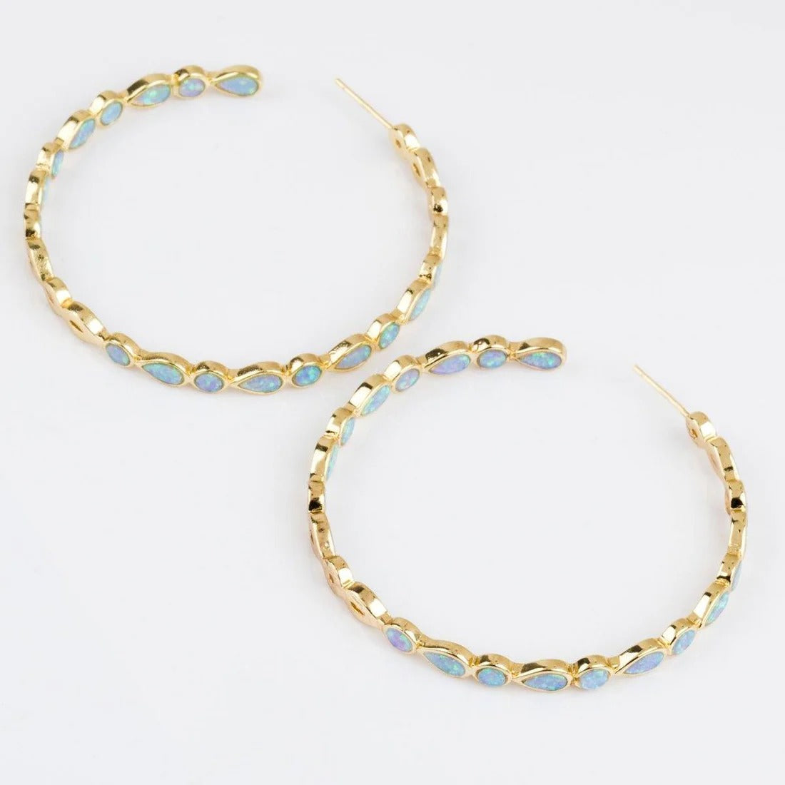 Raya – Vintage gold hoops with blue opal