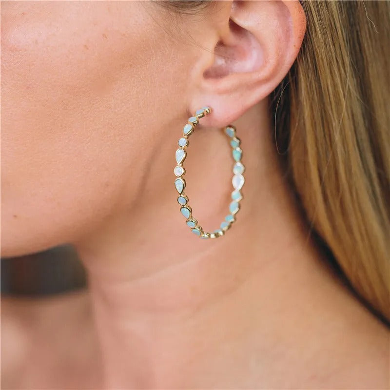 Raya – Vintage gold hoops with blue opal