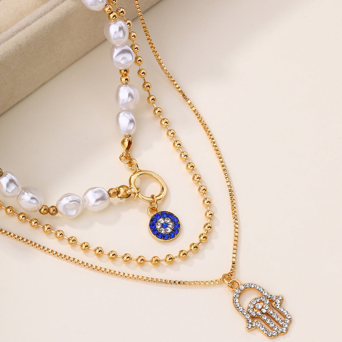 Jade – Multi-level Pearl Necklace and Hamsa