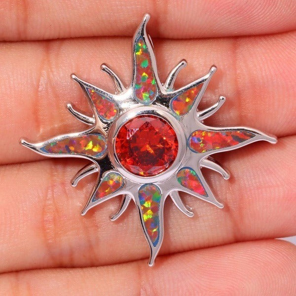 Yani – Necklace with sun ray pendant of fire opal and garnet