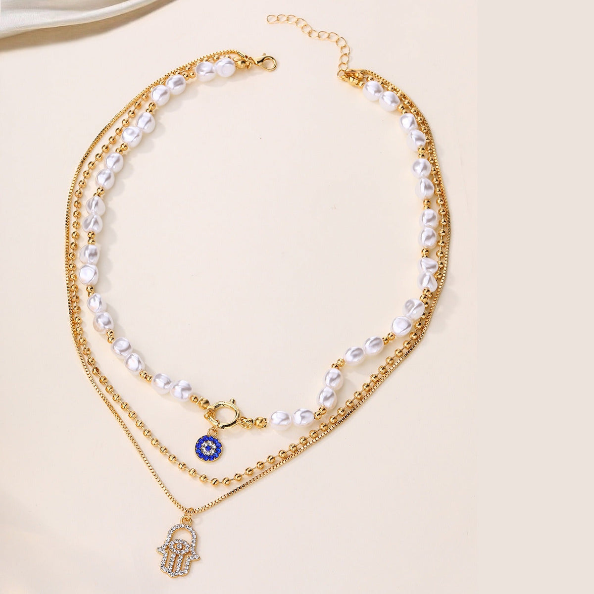 Jade – Multi-level Pearl Necklace and Hamsa